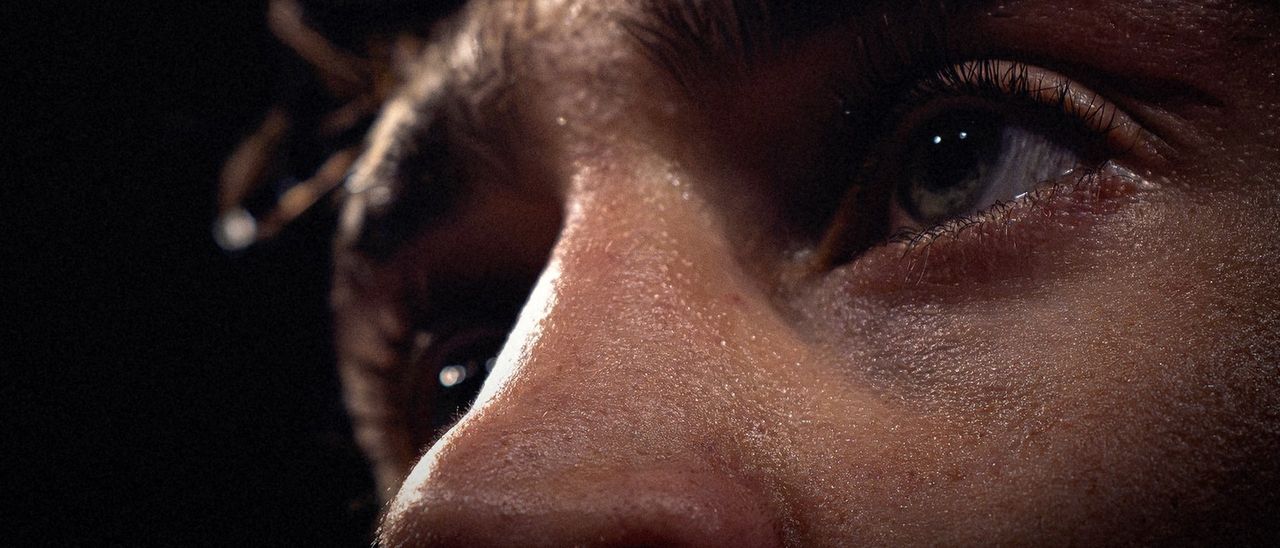 Close-up of a fighter’s eye, focused just before the fight